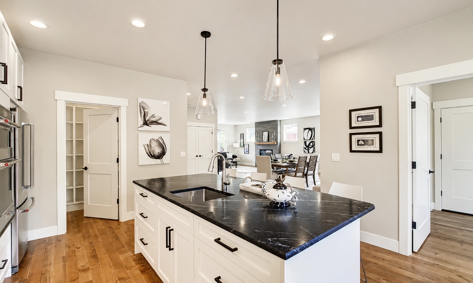 Bright kitchen with black countertops refreshed by a expert house painter Mercer Island.